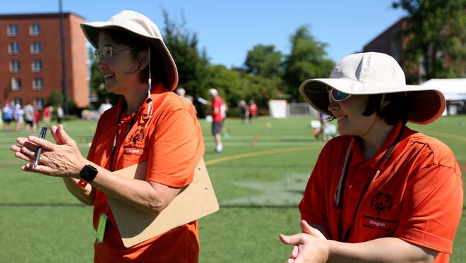 Sue Hill and her daughter, Jenny Hill, 30, of Salem, cheer on their Marion County teammates and their opponents during the Special Olympics Oregon Summer State Games at Oregon State University in Corvallis on Saturday, July 8, 2017. Sue coaches her daughter and the rest of the Marion County Special Olympics bocce ball team.
