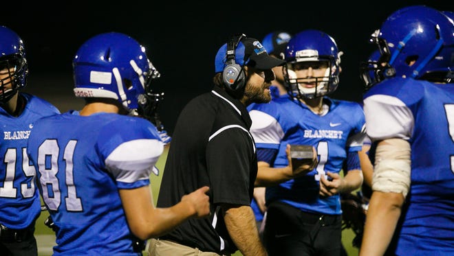 Blanchet head coach Justin Hubbard talks to players in a PacWest Conference game against Salem Academy on Friday, Sept. 15, 2017, at McCulloch Stadium in Bush's Pasture Park. Blanchet won the game 22 to 12.