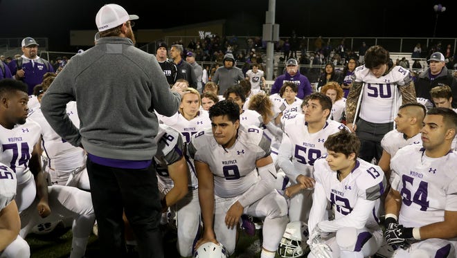 Shasta Wolves head football coach J.C. Hunsaker thanks the team for all their hard work this season after the Wolves 41-6 loss Saturday to Bishop Diego.
