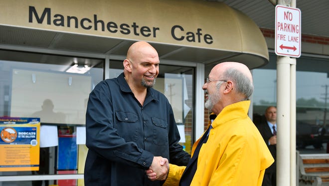 John Fetterman, Democratic nominee for Pennsylvania lieutenant governor, greets Gov. Tom Wolf outside the Manchester Cafe for lunch Wednesday, May 16, 2018, in Manchester Township. Fetterman, a Central York alumnus and the mayor of Braddock, won the Democratic nomination Tuesday evening. Wolf, a York County native, is running for his second term as Pennsylvania governor.