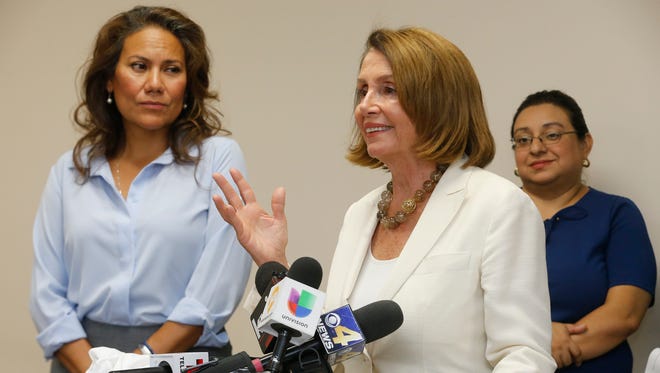 Congressional candidate and former El Paso County Judge Veronica Escobar stands with House Minority Leader Nancy Pelosi after speaking Wednesday with a group of El Pasoans on the front lines of the immigration crisis. With the national spotlight on El Paso and the border after the separation of thousands of families seeking safety, Pelosi visited with nonprofit leaders, immigration attorneys, DACA participants and Escobar to understand the impact of U.S. immigration policies on immigrant families and to consider solutions for fixing the system in order to keep families together.