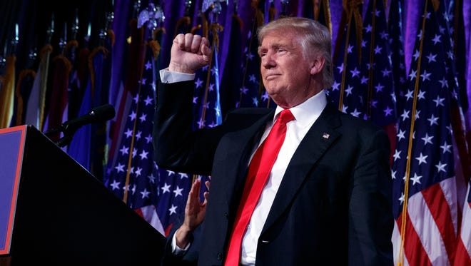 President-elect Donald Trump pumps his fist during an election night rally, Wednesday, Nov. 9, 2016, in New York.