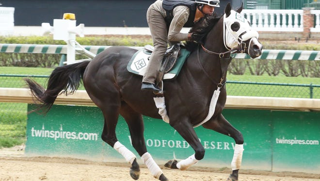 Tom's Ready gets in a gallop Monday at Churchill Downs.
