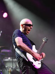 Guitar master Joe Satriani performs with Def Leppard's