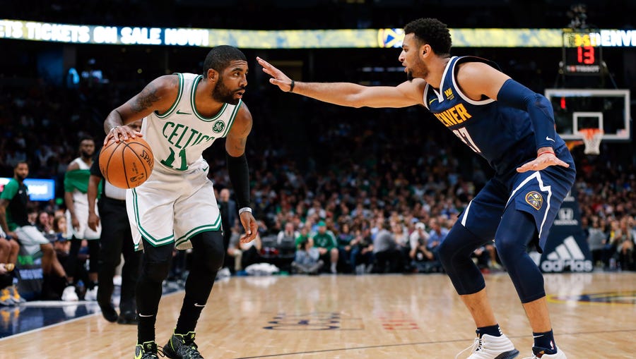 Jamal Murray guards Kyrie Irving.