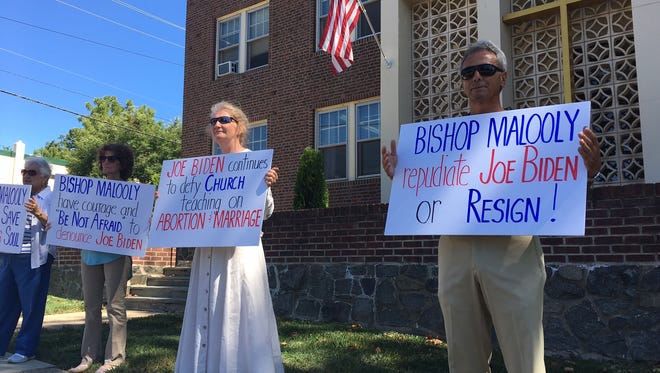 Phil Santoro (right) joins three other protesters calling on Wilmington Bishop Francis Malooly to "repudiate" Vice President Joe Biden.