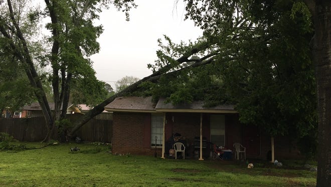 Severe thunderstorms rumbled through the region Monday morning causing widespread power outages and property damage. This photo shows a tree on a home in Prattville.