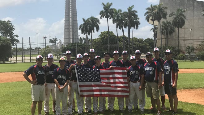 The Grosse Pointe Avengers, an Under-16 travel baseball team, pose with the American flag on Aug. 3 while on a trip to Cuba. The youth team is believed to be the first from Michigan to travel to Cuba since the island nation's revolution ended in 1959 and the U.S. imposed travel restrictions. Pictured in the background is Revolution Square in Havana, where Fidel Castro and other political leaders addressed citizens.