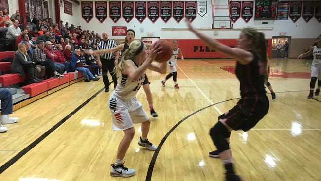 Pleasant's Ashley Anderson looks to pass while being defended by Cardington's Kyndall Spires in a game earlier this year. The two teams play Tuesday night in Division III district semifinal games.
