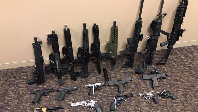 Twenty-one firearms were sized at a northeast side home Thursday morning.