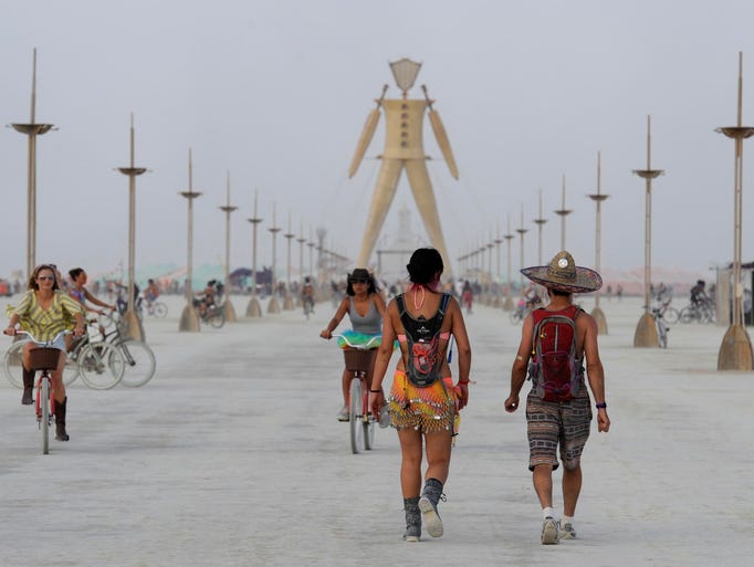 Images of Burning Man participants on the Black Rock