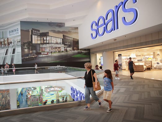 Customers shop at a Sears store in Woodfield Mall July