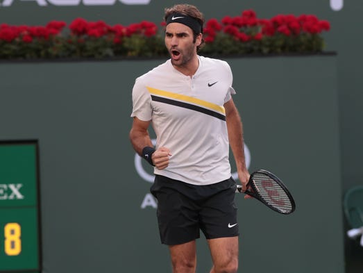 Roger Federer reacts after a break point in the second