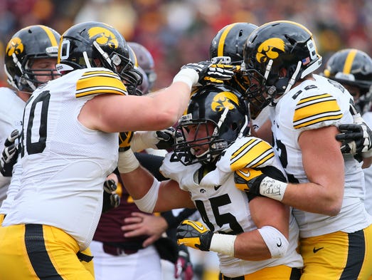 Mark Weisman #45 of the Iowa Hawkeyes celebrates a