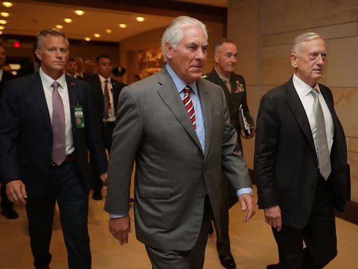 Secretary of State Rex Tillerson (C), Defense Secretary