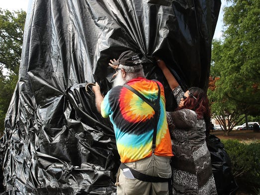  A women tries to stop John Miska from cutting off