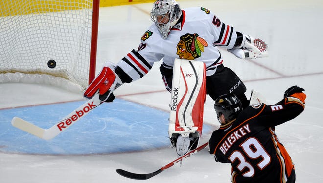 Anaheim Ducks left wing Matt Beleskey right, scores the game-winning goal past Chicago Blackhawks goalie Corey Crawford during overtime in Game 5. The Ducks won 5-4 to take a 3-2 series lead in the Western Conference final.