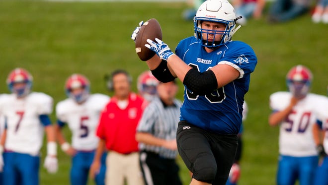 Cros-Lex's Luke Wilson catches a pass during a football game Friday, August 28, 2015 at Croswell-Lexington High School.