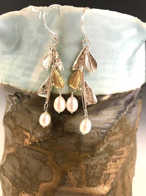 Earrings by Alicia Winalski, one of the artists featured in a jewelry trunk Show July 1 at Plum Bottom Pottery & Gallery.