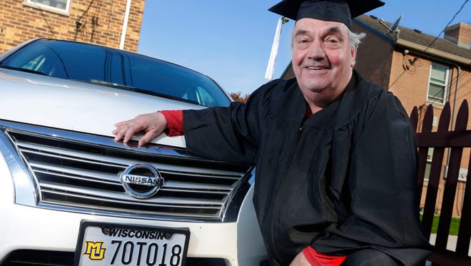 Joe Harding dons his cap and gown next to his car with a personalized Marquette University license plate 70TO18, referring to the year he began college and the year he's graduating.  Harding started strong at Marquette the first time around but lost interest in his senior year and didn't finish. A few years ago, he got Marquette to take him back.