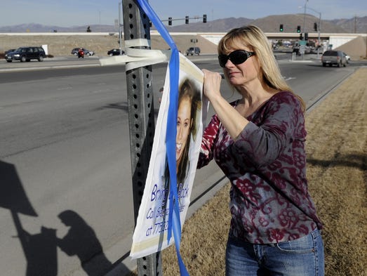 Search volunteer Debbie Fletcher removes a Brianna