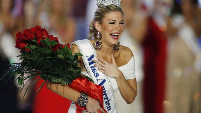 In this Jan. 12, 2013 file photo, Miss New York Mallory Hytes Hagan reacts as she is crowned Miss America in Las Vegas. Hagan’s appearance and sexual habits were mocked in the emails.