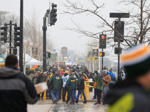 Packers fans arrive to the stadium before the Green