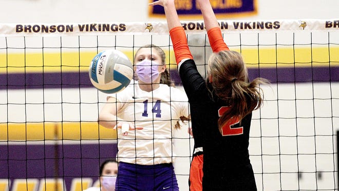 Skye Woodman of Bronson pounds home a kill against Quincy on Tuesday.