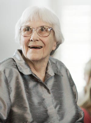 In this August 2007 file photo, author Harper Lee smiles during a ceremony honoring the four new members of the Alabama Academy of Honor at the Capitol in Montgomery, Ala.