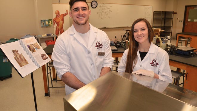 Pre-med students Brittney Miller and Cade Wilke serve as biology lab assistants at Evangel University. Miller grew up in Ash Grove, while Wilke came from Kentucky on a football scholarship.