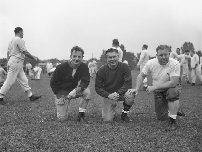Green Bay Packers coach Curly Lambeau, center, with