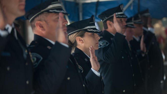 Linda Alicea, who was promoted to lieutenant in the Camden County Police Department in Camden, makes her pledge with other newly promoted officers during a ceremony at police headquarters on Monday morning, June 1, 2015. Alicea is the department's first Latin American lieutenant, and was promoted at the official opening of San Juan Bautista celebrations in the city of Camden.