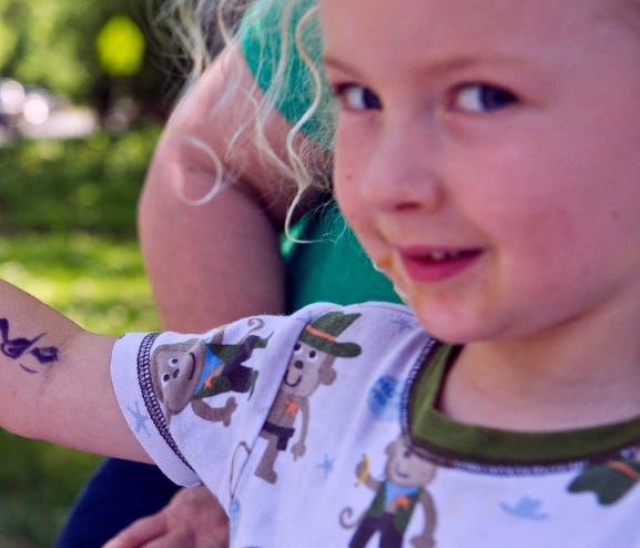 Young entrepreneur Margot Liese, 3, takes a very personal approach to advertising a lemonade stand in Walla Walla, Wash., on June 29.