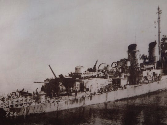 This photo of the Laffey after Okinawa hangs on Bill Kelly's wall.