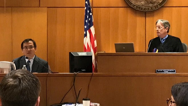 Chensheng "Alex" Lu testifies Tuesday in the trial in which Erik Joe Morales' attorneys attempted to show that the boy developed a facial birth defect because his mother absorbed high levels of pesticides in 2007.