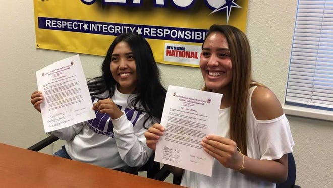 Bloomfield's Kara Watchman, left, and Destiny Walther signed national letters of intent to play basketball for Haskell Indian Nations University.