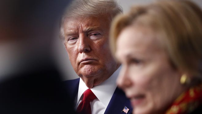 FILE - In this March 31, 2020, file photo President Donald Trump listens as Dr. Deborah Birx, White House coronavirus response coordinator, speaks about the coronavirus in the James Brady Press Briefing Room of the White House in Washington.