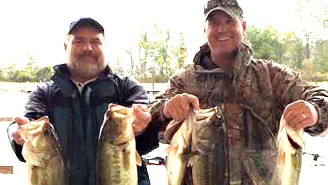 Bill McKay (left) and Corey Sullivan stayed with buzzbaits in the lily pads to win the Sunset Marina at 43 Championship on Barnett Reservoir.