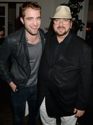 Robert Pattinson, left, poses with director/writer