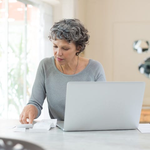 Older woman looking at a laptop