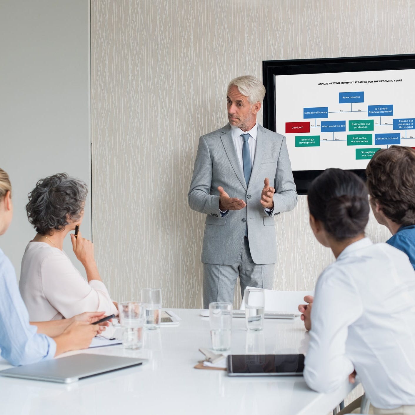 Man speaking at a business meeting.