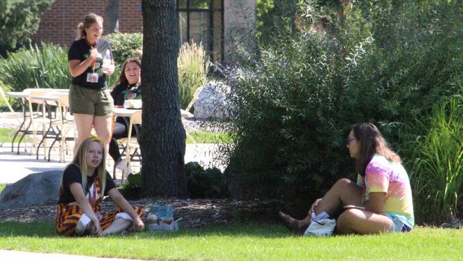 UMN Crookston students chat on the Campus Mall
