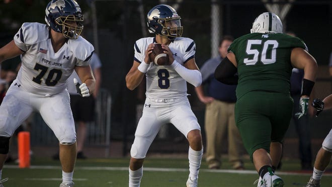 Pope John quarterback Peter Delaportas drops back for a pass during their 52-28 loss against DePaul Friday, August 30, 2019, in Wayne.