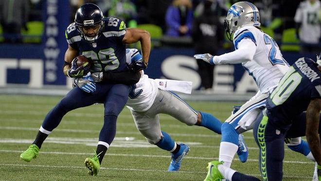 Seahawks wide receiver Doug Baldwin (89) looks for yardage against Detroit during the second half.