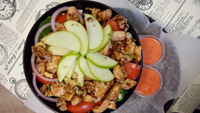 The Apple Walnut Salad topped with grilled chicken.