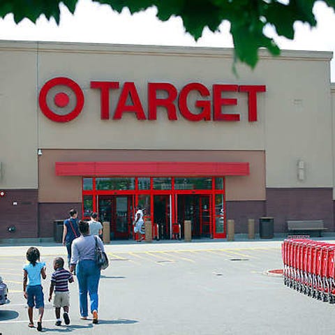 Shoppers walk Friday toward the Target store in Va