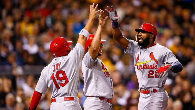PITTSBURGH, PA - SEPTEMBER 30: Jason Heyward #22 of the St Louis Cardinals is congratulated at home plate by teammate Jon Jay #19 after hitting a grand slam home run in the third inning against the Pittsburgh Pirates during the game at PNC Park on September 30, 2015 in Pittsburgh, Pennsylvania. (Photo by Jared Wickerham/Getty Images)