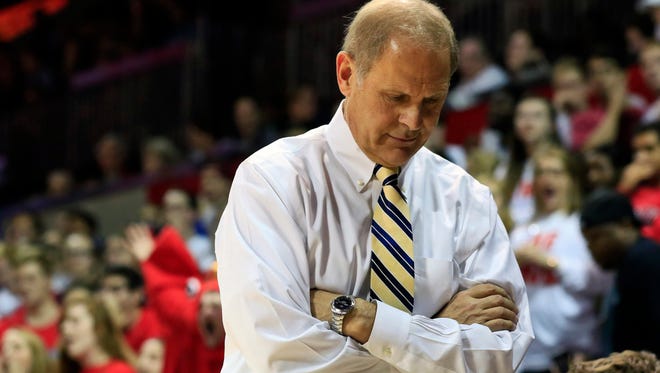 Michigan basketball coach John Beilein paces on the sideline against Southern Methodist.