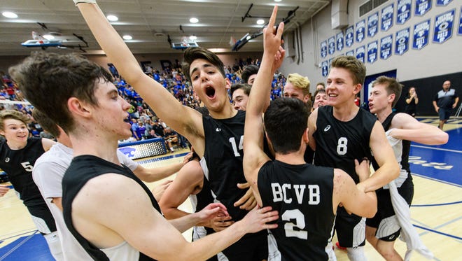 Boulder Creek celebrates their win of the AIA Div 6A Boy's Volleyball State championship game on Friday, May 12, 2017, at Mesquite High School in Gilbert, Ariz.