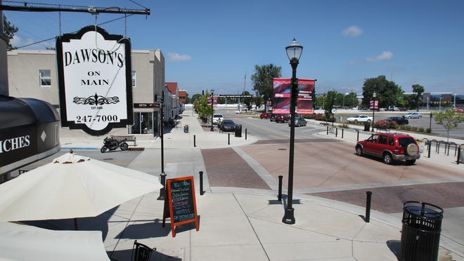 
The Town of Speedway is opening its new roundabout that connects West 16th Street, Crawfordsville Road and Main Street and in the process, cut off the south access to Georgetown Road. This view shows Main Street looking north from the Dawson's on Main restaurant. 
